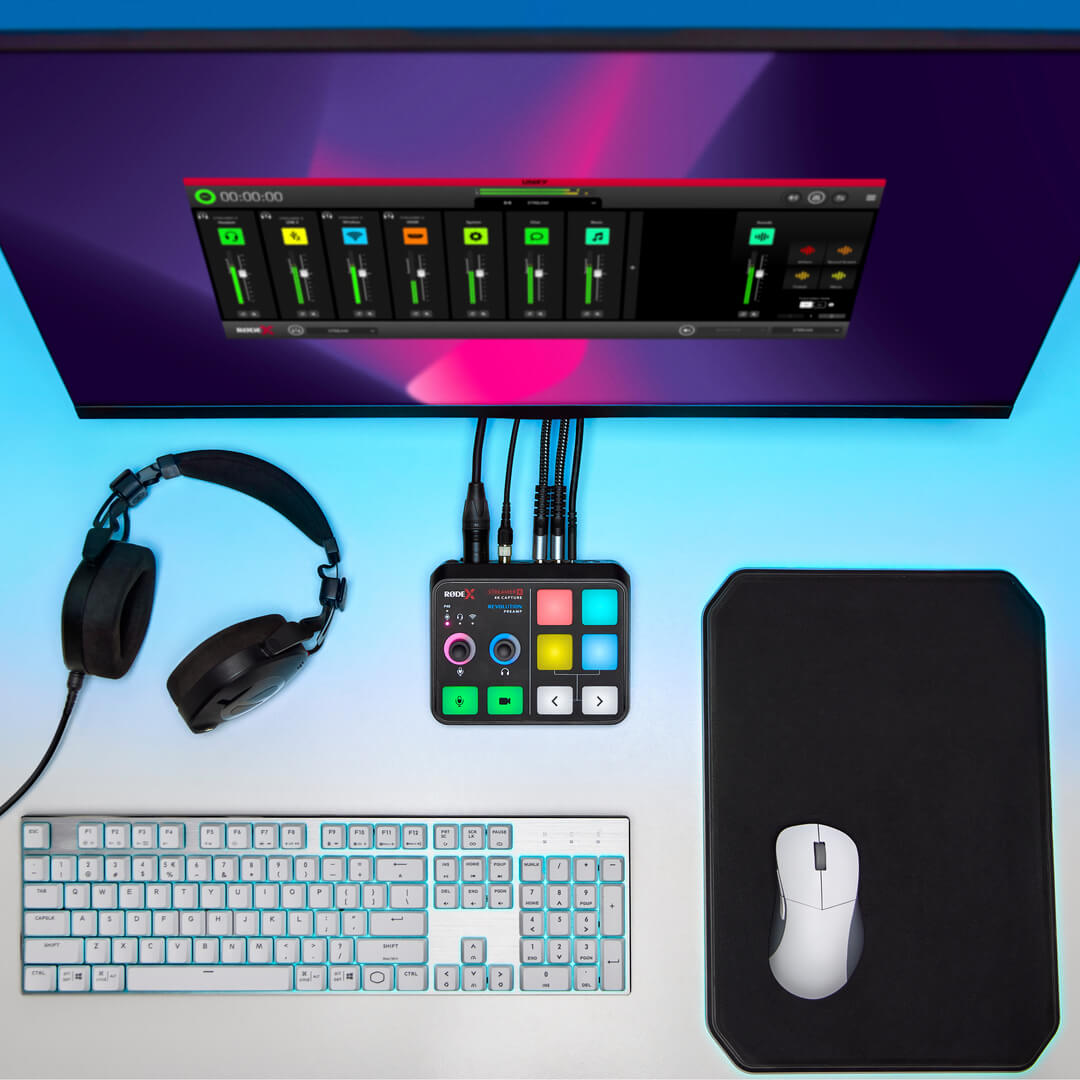 RØDE reference: audio interface and video capture device connected to a computer, with headphones and cables